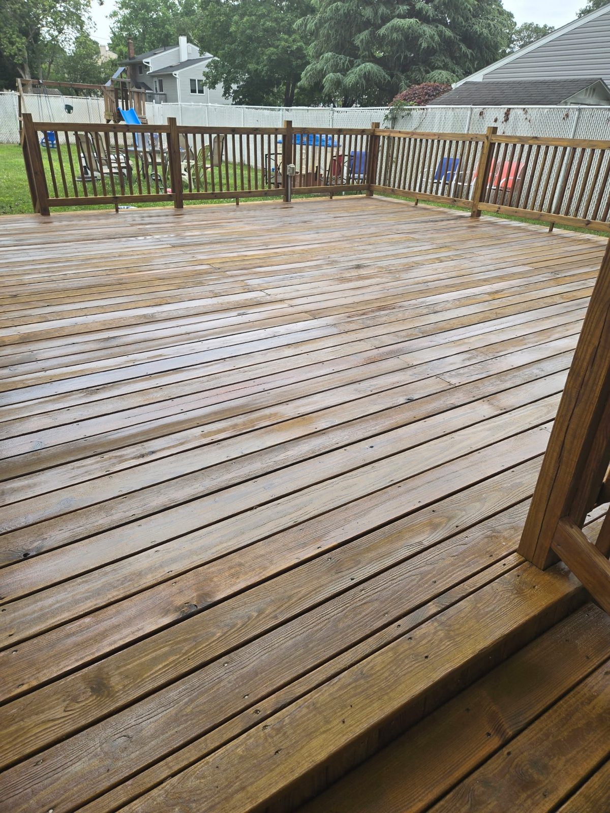 A weathered grey deck before work